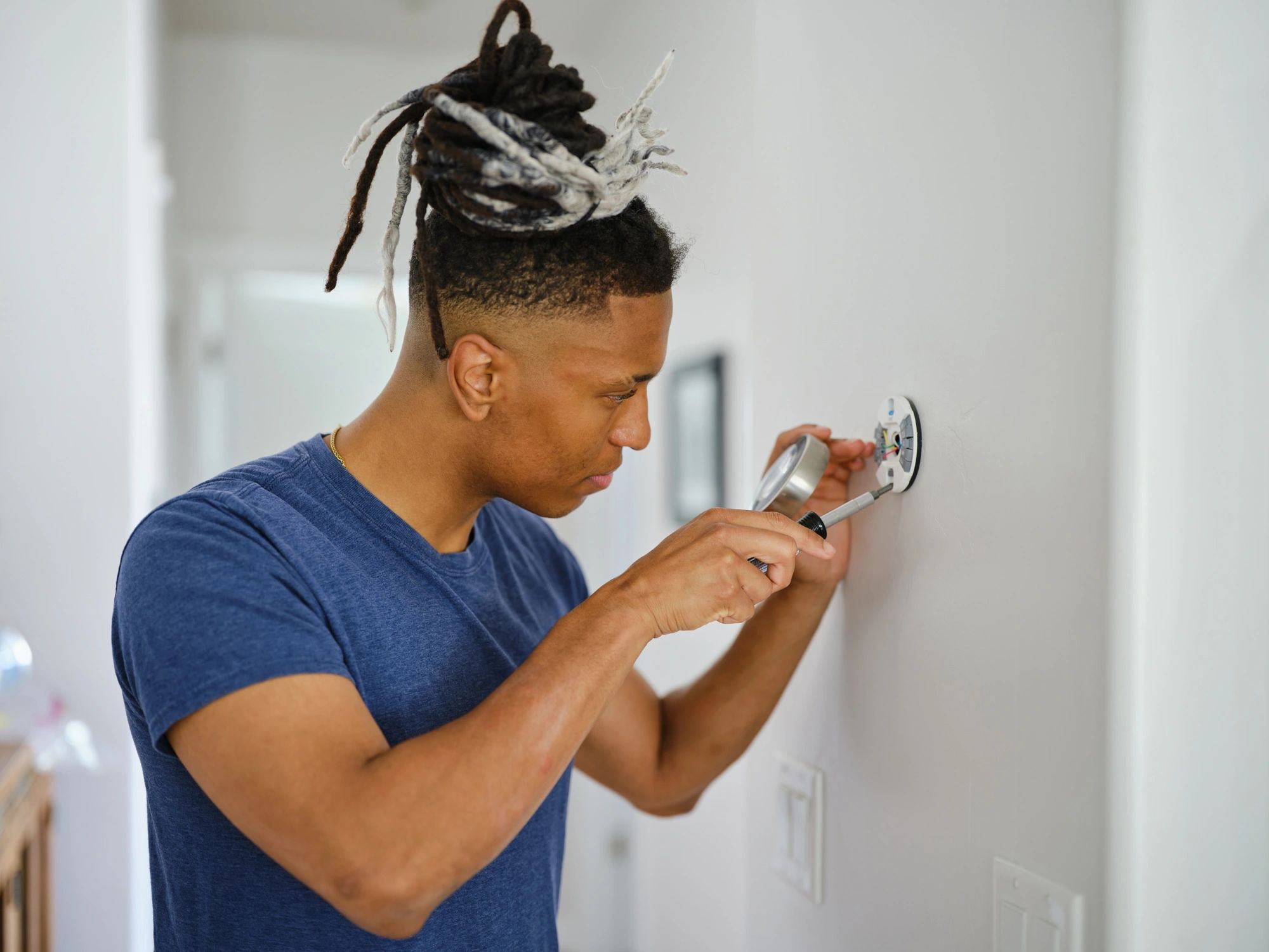 Technician installing a smart home device
